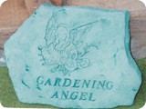 MVSI 779.  Gardening angel Gardening Plaque